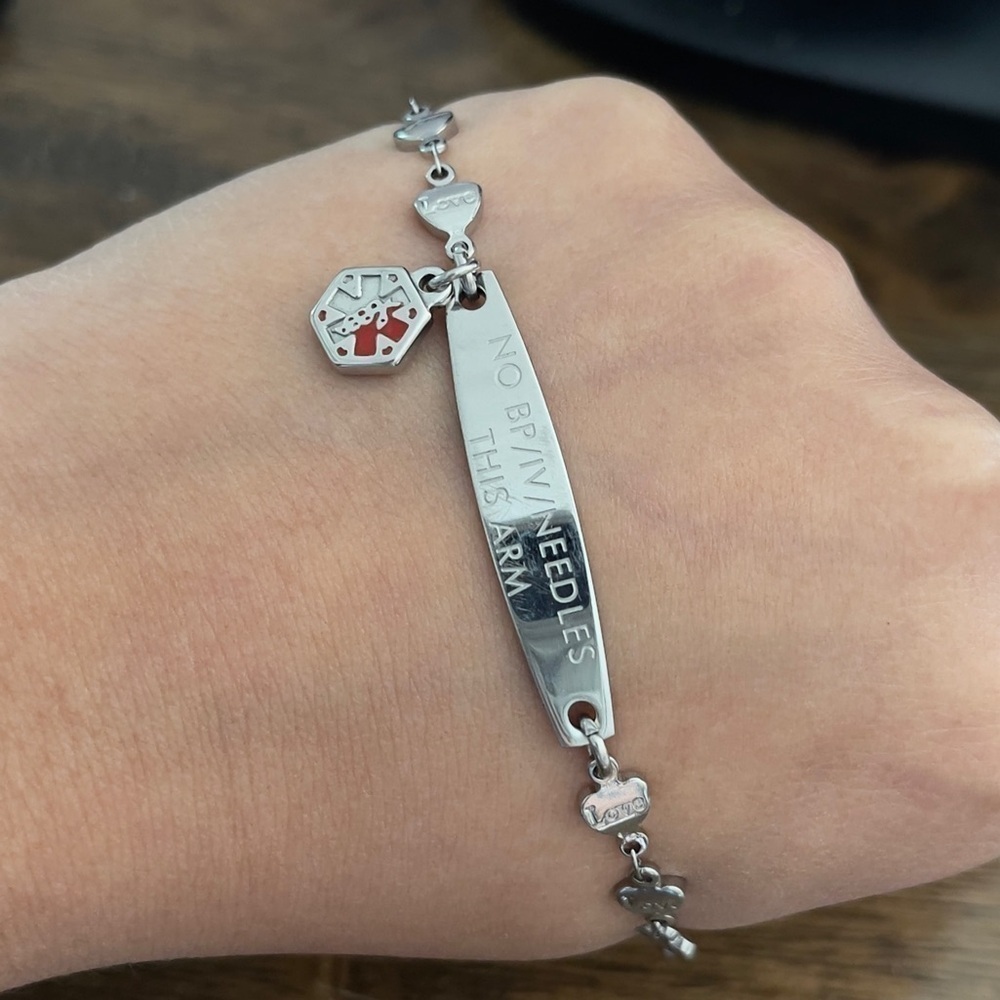 Medical ID alert no bp no iv on this arm bracelet